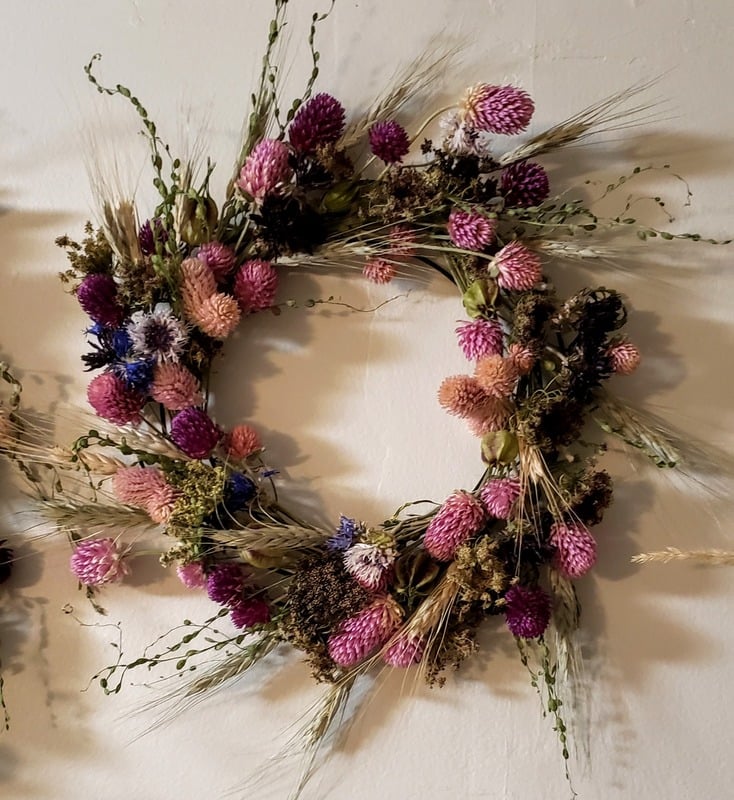 A dried floral wreath with flowers available for sale from Grace's Flower Farm